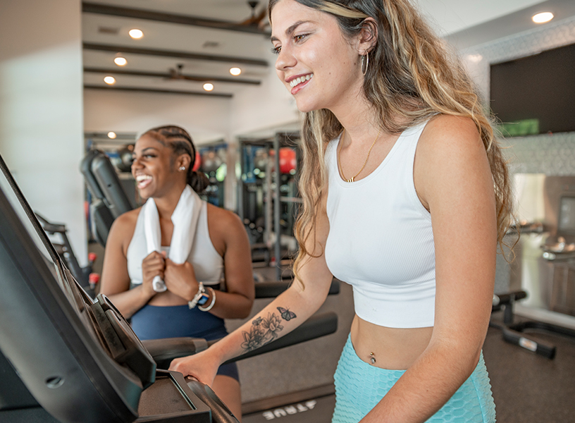 Young woman in the gym on a treadmill