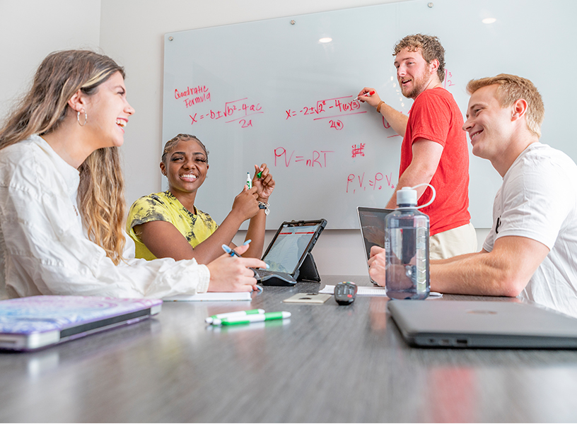 Group of young adults studying together