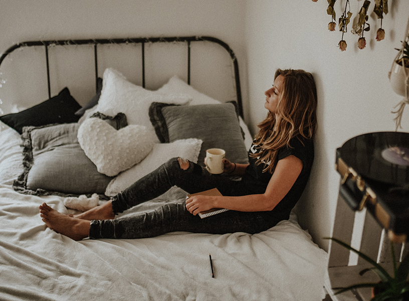 Woman and her dog relaxing in a cozy home